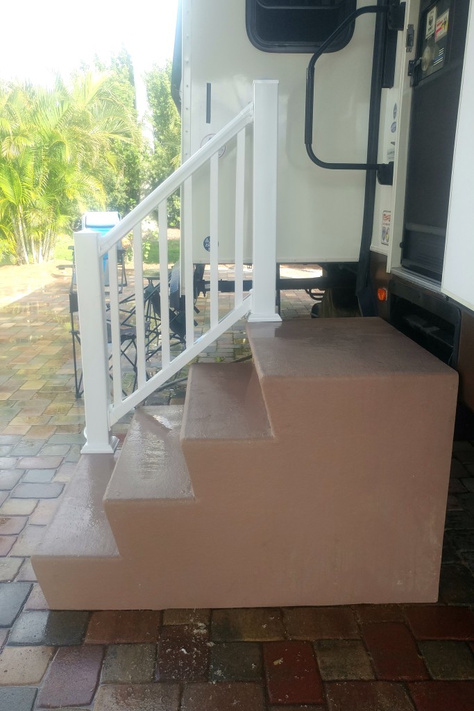 The finished railing on painted steps