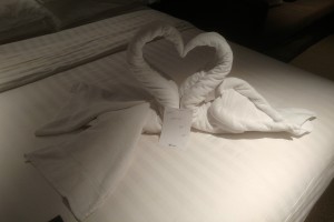 Kissing swans towel art